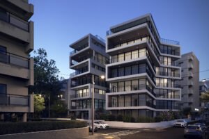 prédio residencial de sete andares de arquitetura moderna com varandas e guarda corpo metálico e janelas de vidro
