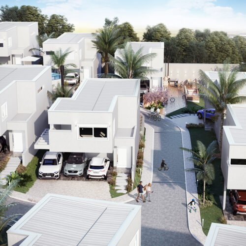 vista aérea de um condominio de sobrados individuais de arquitetura moderna na cor gelo sendo todos iguais, com estacionamento aberto e coberto, ruas em bloquete de concreto com pessoas circulando