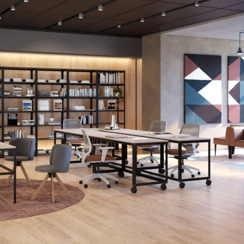 coworking com ilha em mesa moveis e cadeiras, sofas e mesa gerencial marelli em tons predominantes em terracota e amadeirado claro