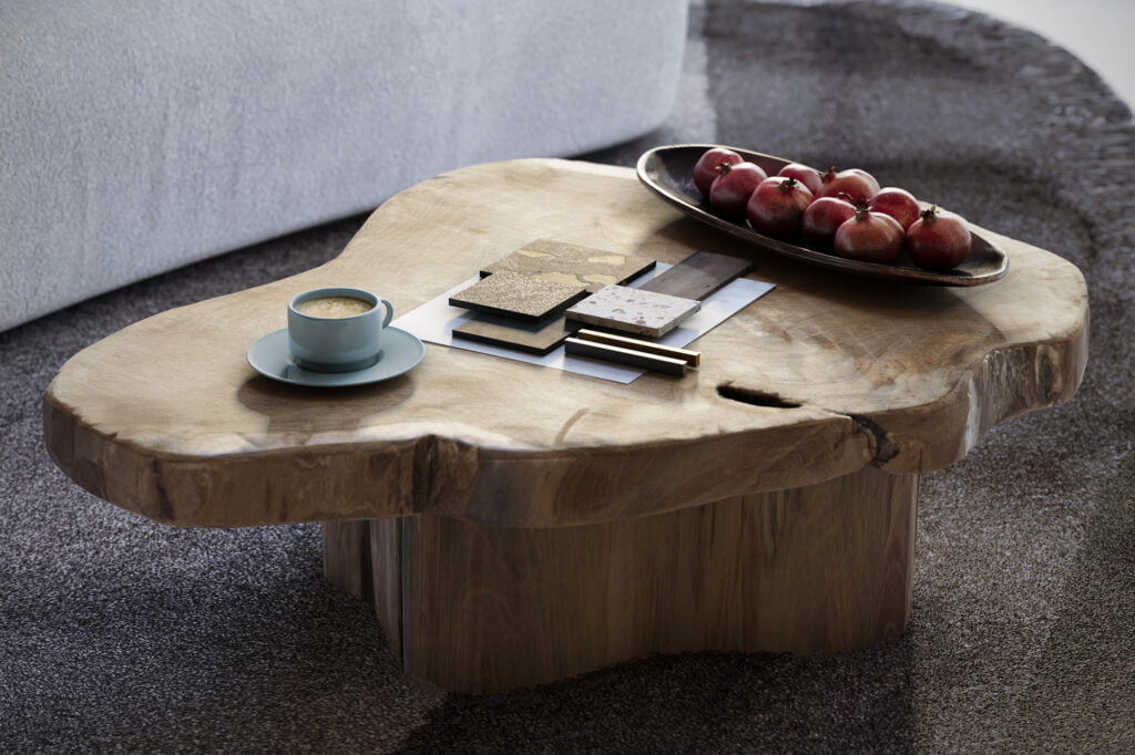 mesa de madeira em tronco bruto de forma organiza com café e materiais dispostos sobre ela